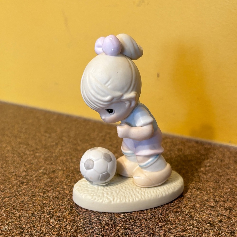 Adorable Figurine with Soccer Ball